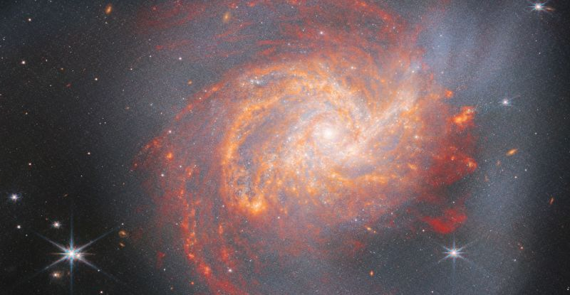 JWST фіксує вогняну спіральну галактику, розкриваючи її напрочуд жорстоку історію