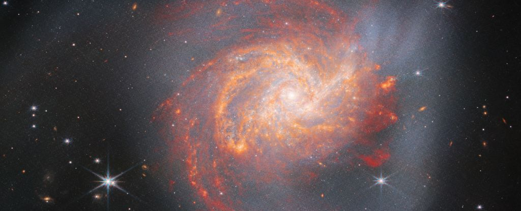 JWST фіксує вогняну спіральну галактику, розкриваючи її напрочуд жорстоку історію