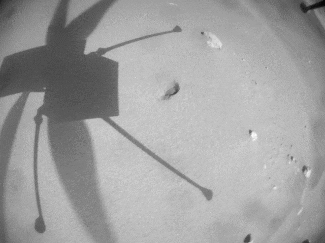 Ingenuity's shadow on its 25th flight, as captured by its own navigation camera on April 8, 2022.