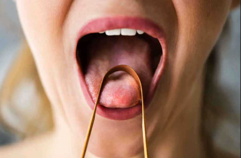 Скребок для язика: Які переваги та як він працює?
